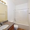 Bathroom with granite vanity and tub-shower combo