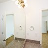 Bathroom with vanity mirror and tub-shower