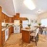 Kitchen with island seating and dining area by sliding door