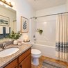 Bathroom with granite vanity and tub