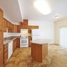Kitchen with island and sliding patio door