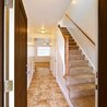 Entry hall with stairs to the upper level